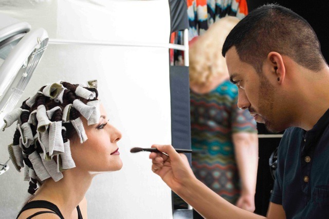 Make-Up Artist Daniel Chinchilla prepping model Jacqueline Depaul with rag curlers